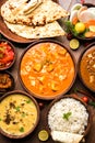 Indian lunch or dinner items like dal, paneer butter masala, roti, rice, salad Royalty Free Stock Photo