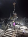 Indian Majdoor doing high rise building made for cement concrete at night