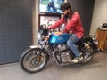 INDIAN MALE BIKE RIDER. PHOTO OF ROYAL ENFIELD GT CONTINENTAL 650