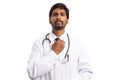 Indian doctor adjusting tie