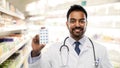 Indian male doctor or pharmacist with pills