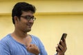 Indian male model watching mobile
