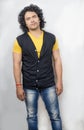 Indian male model wearing half yellow tshirt and blue jeans Royalty Free Stock Photo