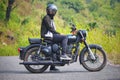 Indian male on a Royal Enfield 500 Stealth Black