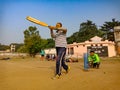 an indian man batting during cricket match on ground in sky background in india January 2020 Royalty Free Stock Photo