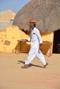 Indian man with beard and mustache wearing traditional clothes in Desert Royalty Free Stock Photo