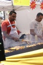 Indian man cooking spicy kebabs