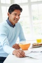 Indian Man Enjoying Breakfast At Home Royalty Free Stock Photo