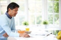 Indian Man Enjoying Breakfast At Home Royalty Free Stock Photo