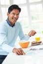 Indian Man Enjoying Breakfast At Home Royalty Free Stock Photo