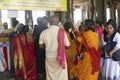 Indian man gives laddu treats to pilgrims