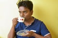 Indian man having green tea while sitting on chair on the morning Royalty Free Stock Photo