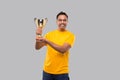 Indian Man Holding Trophy in Hands Isolated Smilling