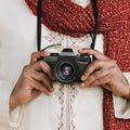 Indian man in a kurta with a digital camera