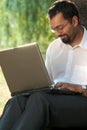 Indian man with a laptop Royalty Free Stock Photo