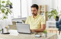 Indian man with laptop working at home office Royalty Free Stock Photo