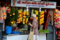 Indian man at Little India flower garland shop Singapore