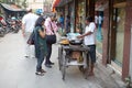 Indian man is making street food near the New Market, Kolkata, India