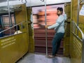 An Indian man in a moving train