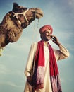 Indian Man On the Phone Camel Communication Concept Royalty Free Stock Photo