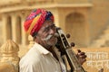 Indian man plays an indian musical instrument similar to Sarangi in Jaisalmer. Royalty Free Stock Photo