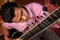 Indian Man Plays a Sitar