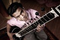 Indian Man Plays a Sitar