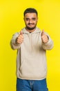 Indian man raises thumbs up agrees or gives positive reply recommends advertisement likes good idea