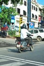 Indian man riding scooter