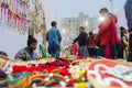 Indian man selling coloutful handmade jewelleries