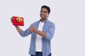 Indian Man Showing Present over Exceded Showing Thumb Up. Man Holding Gift. Surprise. Gift Box. Very Happy Man Isolated Royalty Free Stock Photo