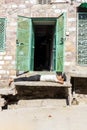 An Indian man sleep outside the house, in the blue city, the old town of Jodhpur Royalty Free Stock Photo