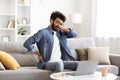 Indian Man Suffering Backache And Neckache After Working With Laptop At Home Royalty Free Stock Photo