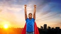 Indian man in superhero cape flying in city Royalty Free Stock Photo