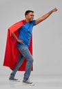 Indian man in superhero cape makes winning gesture Royalty Free Stock Photo