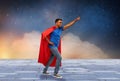 Indian man in superhero cape makes winning gesture Royalty Free Stock Photo