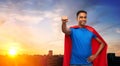 Indian man in superhero cape makes winning gesture Royalty Free Stock Photo