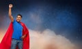 Indian man in superhero cape over night sky Royalty Free Stock Photo