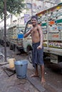 Indian man is washing himself, Kolkata, India