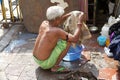 Indian man is washing some clothes, Kolkata, India