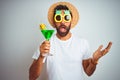 Indian man wearing summer funny look drinking cocktail over isolated white background very happy and excited, winner expression Royalty Free Stock Photo