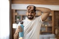 Indian man wiping sweat and drinking water during sport Royalty Free Stock Photo