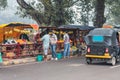 Indian man and woman selling and buying fruits and vegetables on the street. Lifestyle. India