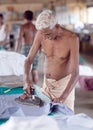 Indian man working Dhobi Ghat in Cochin, India Royalty Free Stock Photo