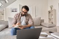 Indian man working or studying online from home office using laptop computer. Royalty Free Stock Photo