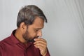 Indian man worried about white hair and hair loss problem at a young age Royalty Free Stock Photo