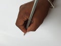 Indian Man writing using Pencil in a hand on white paper Royalty Free Stock Photo