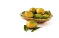 indian mangos in a basket on a white background Fresh yellow ripe mangoes fruit in rattan basket with green leaves isolated on whi Royalty Free Stock Photo