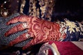 Indian marraige. Hand with hinna and gold ornaments. Photo about indian marraiges. Royalty Free Stock Photo