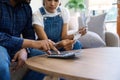 Indian married couple calculating bills, discussing planning budget together, serious wife and husband looking at Royalty Free Stock Photo